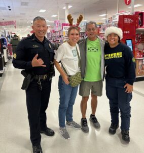 Four people representing four different agencies smiling during Heroes and Helpers event at Target.