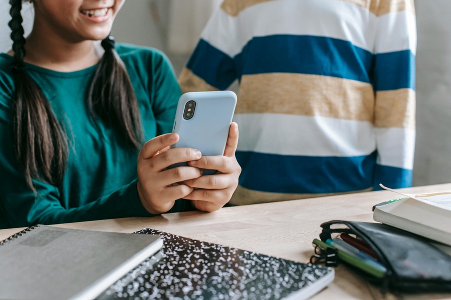 Teen girl holding phone