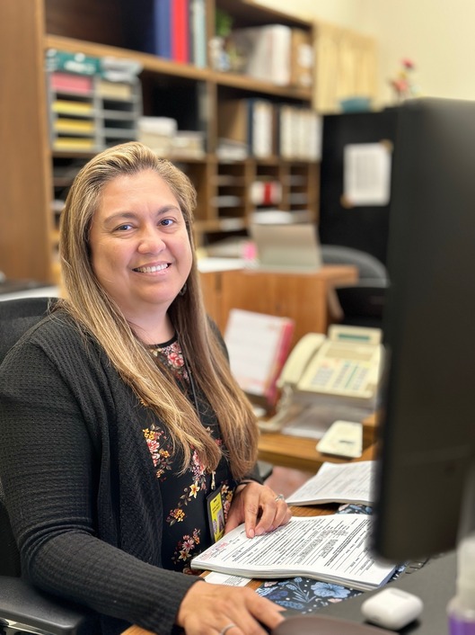 Woman smiling at computer