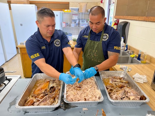 Two men preparing Thanksgiving food