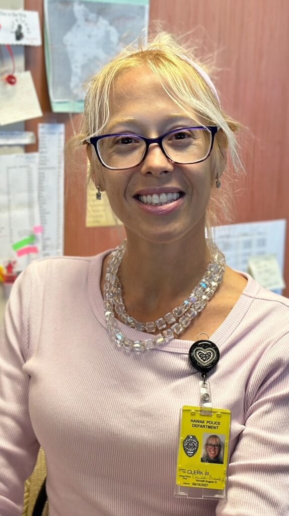 Woman with blond hair in pink sweater