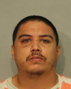 Photo of Christopher Lucrisia, described as Puerto Rican, 5 feet 10 inches tall, 250 pounds, with black hair and green eyes. 