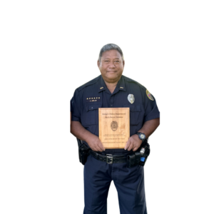 Picture of Officer Augie Akiu holding his wooden plaque award for 2024 Ka'u Officer of the Year.