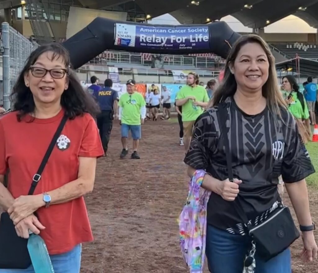 Two women walking in a race