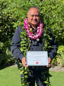 Police Officer Severo Ines holding Officer of the Quarter award by the Hawai‘i Island Safety and Security Professionals Association. 