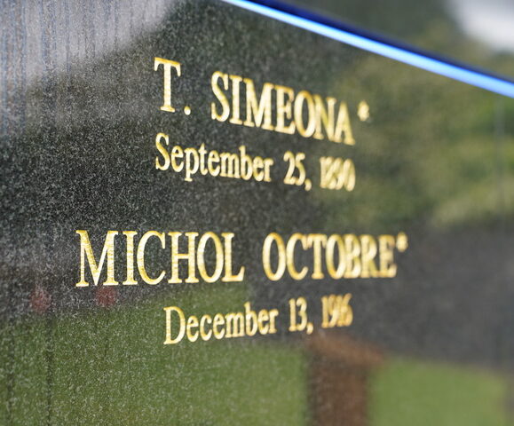 Names of Simeona and Octobre on memorial wall