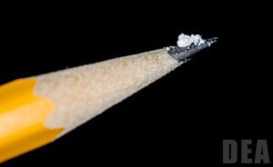 image of a couple grains of salt on the tip of a pencil to illustrate a lethal dose of illicit fentanyl.