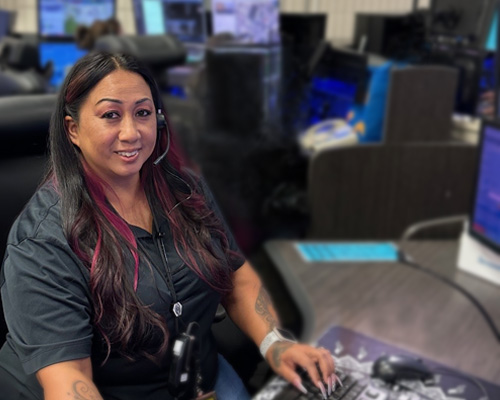 Female dispatcher working at desk