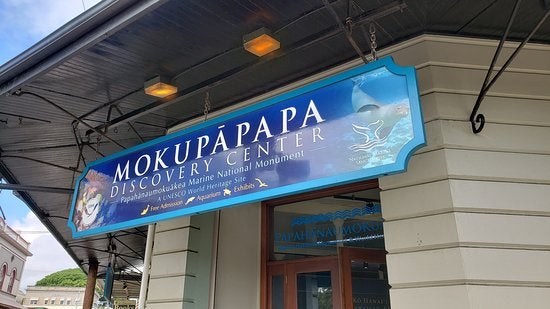 Sign above entrance to Mokupapapa Discovery Center in Hilo.